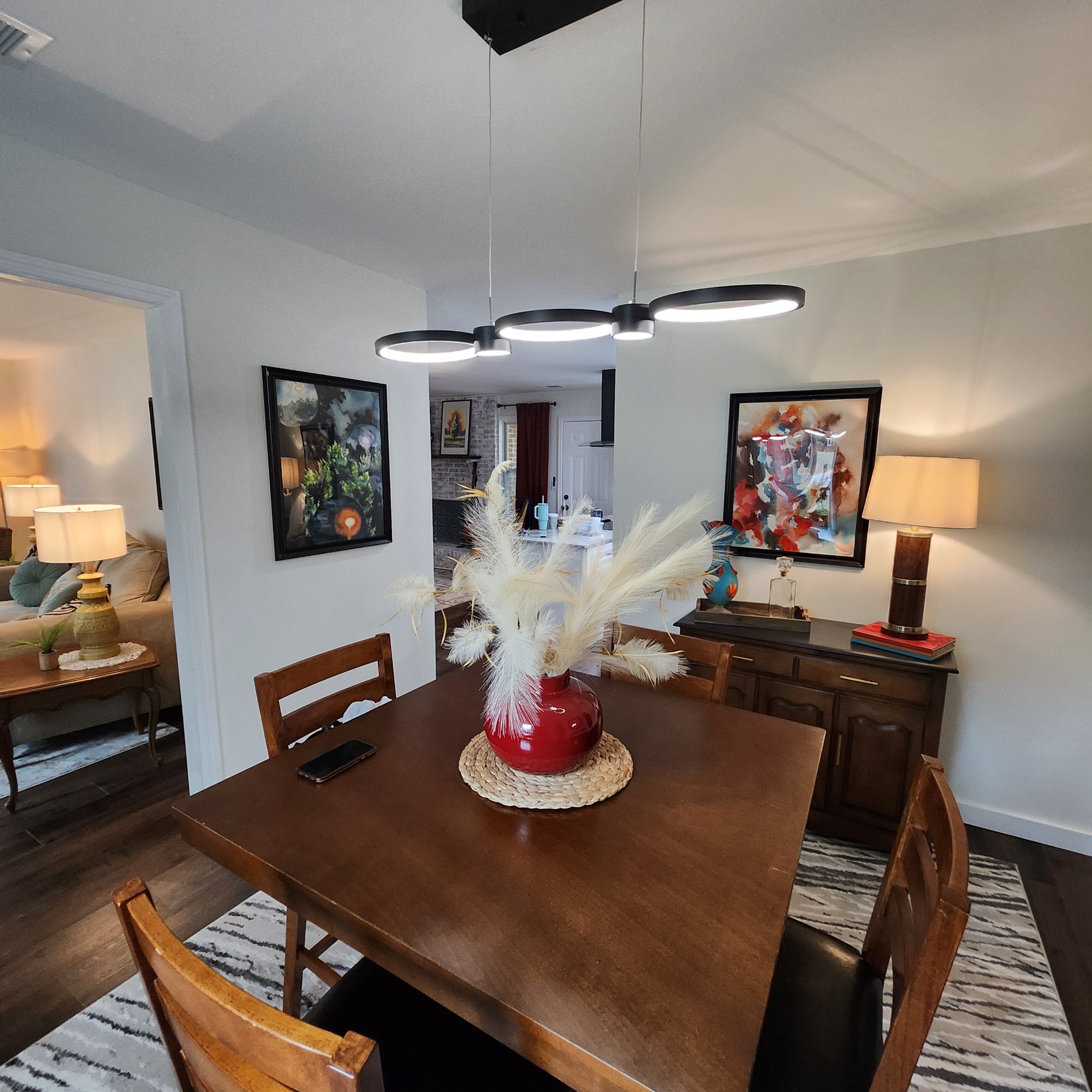 Dining area at Artful Ansley with framed artwork visible in the room