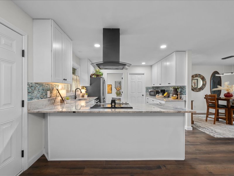 White kitchen island and cabinetry at Artful Ansley in Augusta, Georgia