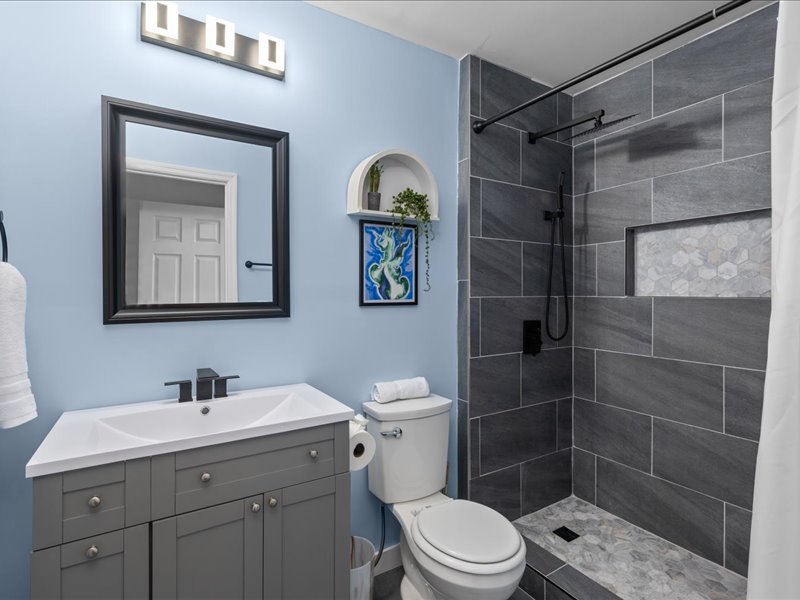 Bathroom with tiled walk-in shower